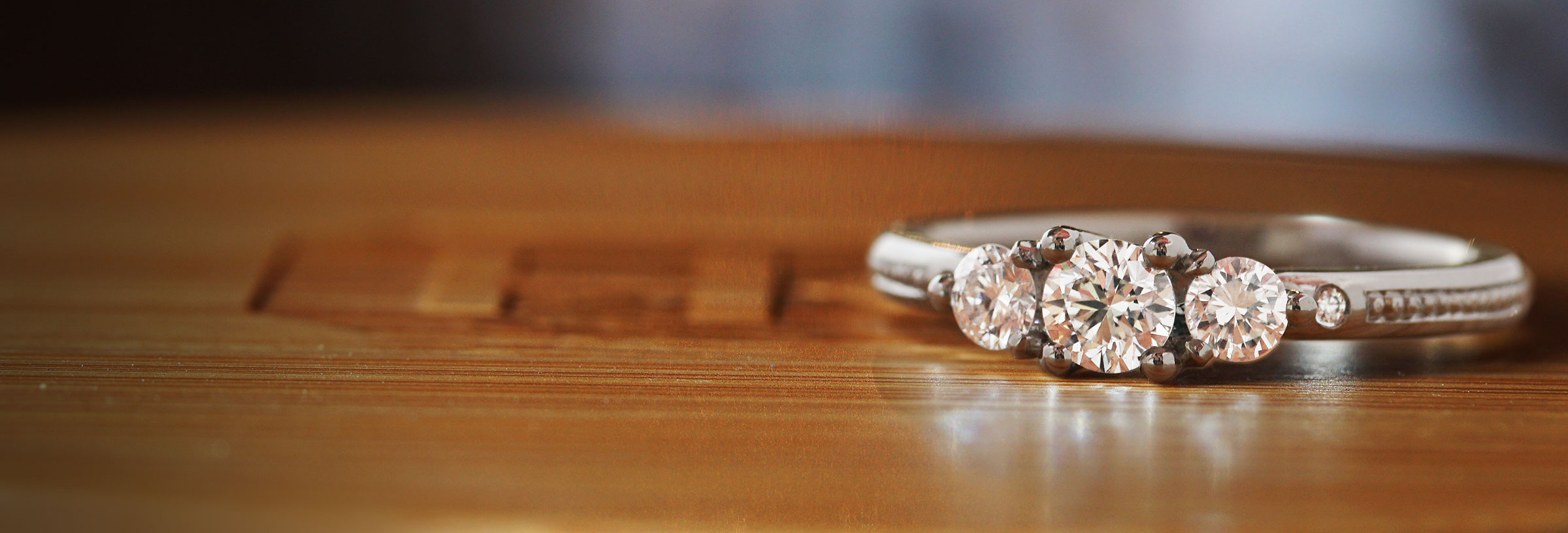 platinum-three-stone-engagement-ring-with-beading-detailing