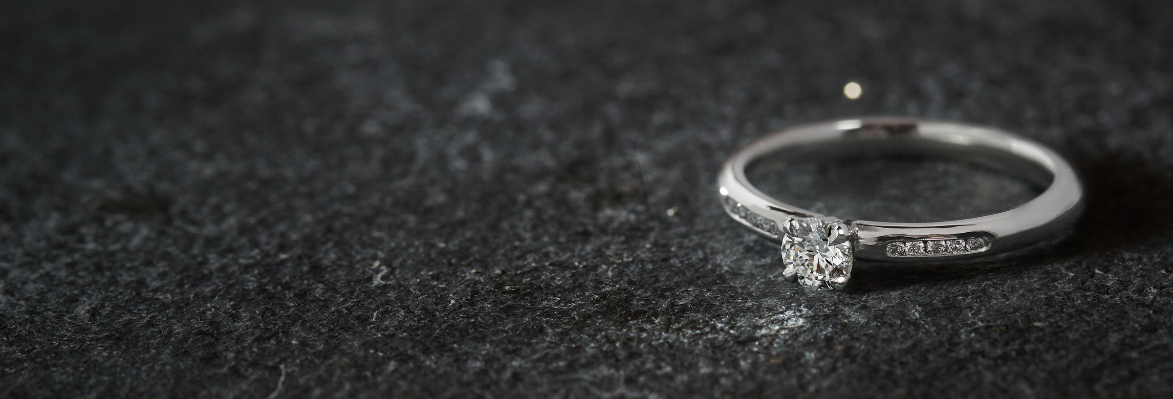 delicate-platinum-and-diamond-engagement-ring-with-channel-set-shoulders