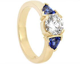 20337-yellow-gold-trilogy-diamond-and-trilliant-cut-sapphire-engagement-ring_1.jpg