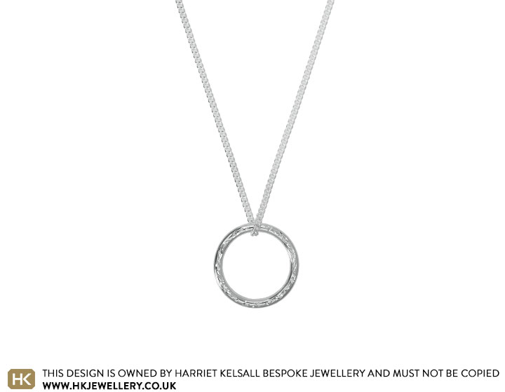 A Sterling Silver Engraved Circular 60th Pendant