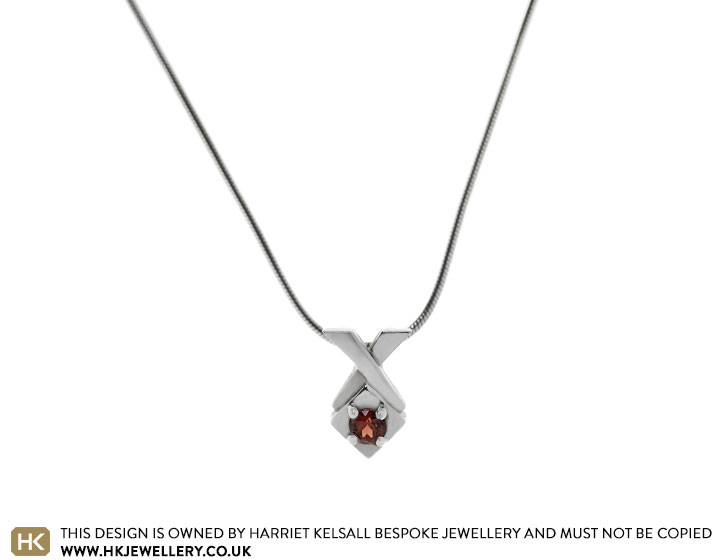 Elegant Sterling Silver and Garnet Crossover Pendant