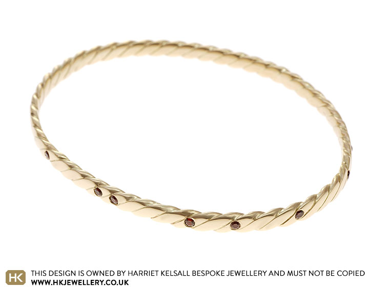 Jayne's Commemorative Twisting 9ct Yellow Gold and Garnet Bangle