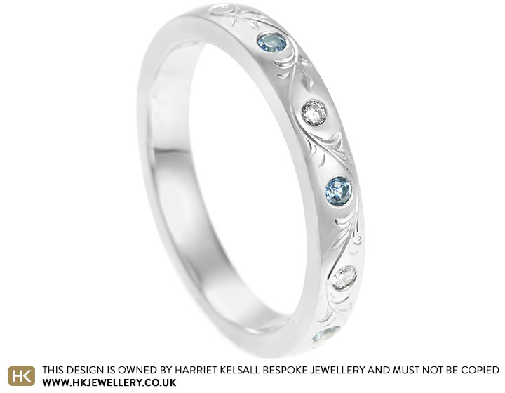 21958-ornate-floral-engraved-platinum-diamond-and-pale-blue-sapphire-eternity-ring_2.jpg