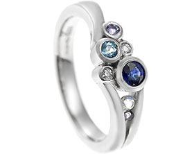 22015-platinum-sappihre-tanzanite-aquamarine-diamond-iolite-and-moonstone-engagement-ring_1.jpg