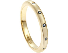 22077-yellow-gold-and-pale-blue-sapphire-eternity-ring_1.jpg
