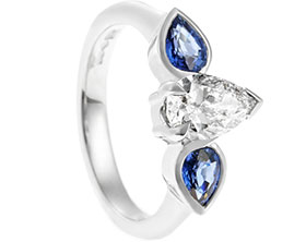 22392-platinum-pear-cut-diamond-and-sapphire-trilogy-engagement-ring_1.jpg