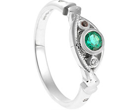 22110-platinum-garnet-emerald-diamond-alexandrite-and-tanzanite-elephant-inspired-eternity-ring_1.jpg
