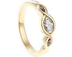 22431-yellow-gold-oval-cut-diamond-aquamarine-and-ruby-twist-eternity-ring_1.jpg