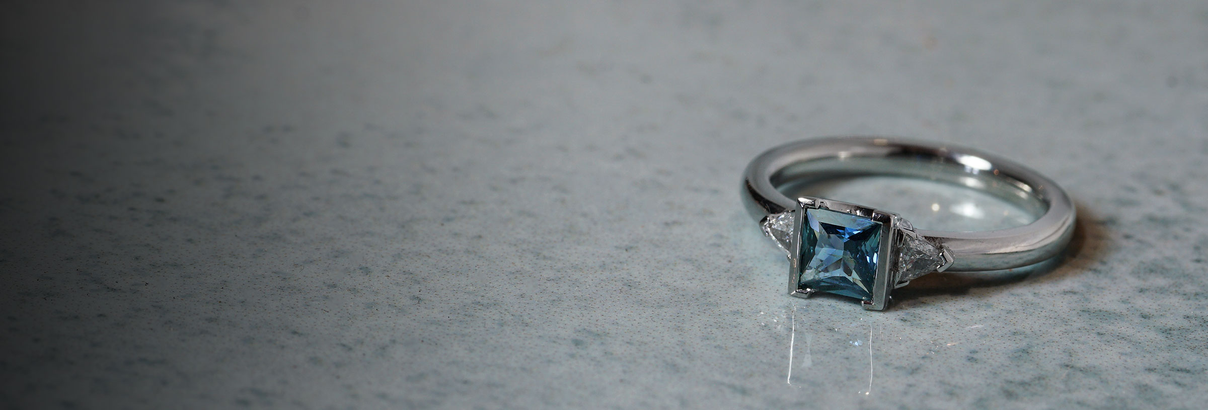 platinum-trilliant-cut-diamond-and-fancy-cut-sapphire-trilogy-engagement-ring