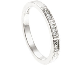 22171-fairtrade-white-gold-eternity-ring-with-princess-cut-diamonds-and-beading-detail_1.jpg