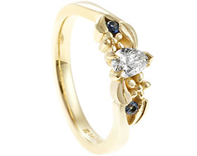 22583-nature-inspired-fairtrade-yellow-gold-pear-cut-diamond-and-sapphire-engagement-ring_1.jpg