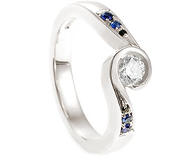 22868-white-gold-twist-engagement-ring-with-diamond-and-graduating-sapphires_1.jpg