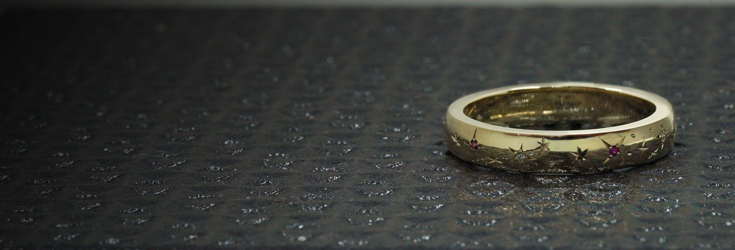fairtrade-yellow-gold-eternity-ring-with-star-set-rubies-and-diamonds