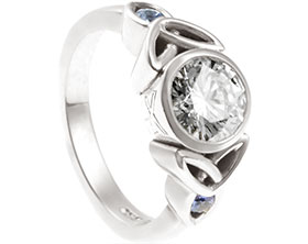 23113-white-gold-celtic-twist-engagement-ring-ith-sapphire-and-diamonds_1.jpg