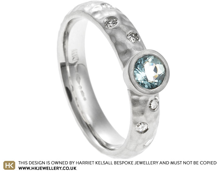 Maureen's platinum aquamarine and diamond hammered engagement ring