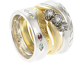 23659-white-gold-eternity-rings-with-celtic-engraving-and-mixed-gemstones_1.jpg