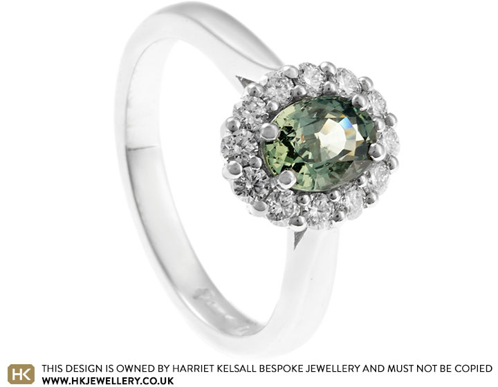 Sonia's Platinum Engagement Ring with Green Sapphire and Diamond Halo