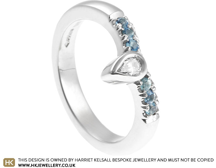 Faye's sky blue topaz and pear cut diamond wishbone style eternity ring