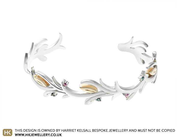 Kirsty's silver and gold floral bangle set with topaz and sapphires