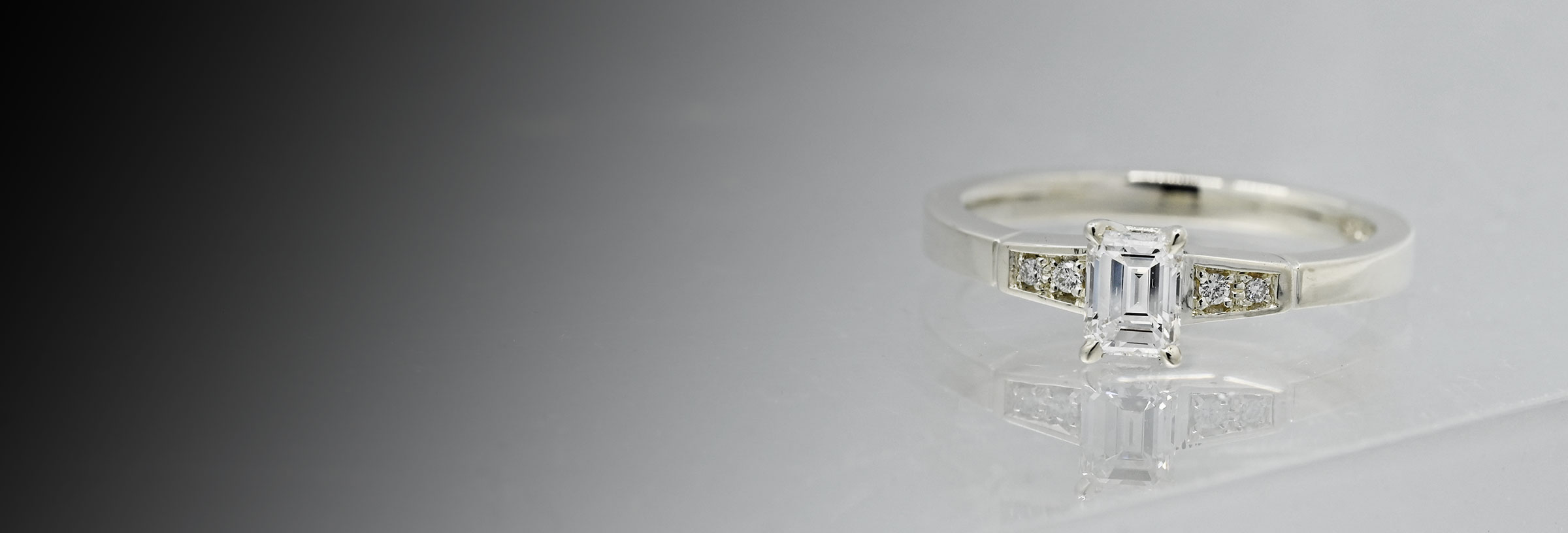 white-gold-and-emerald-cut-diamond-engagement-ring
