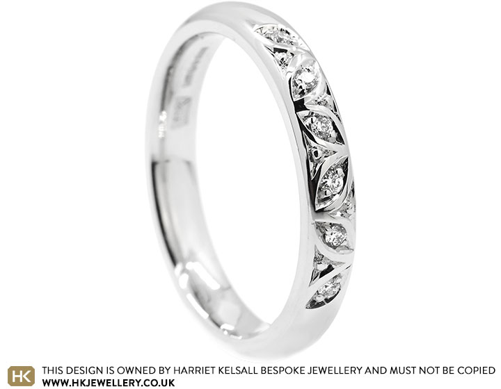 24443-platinum-eternity-ring-with-brilliant-cut-diamonds-and-decorative-beading_2.jpg