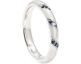 24815-white-gold-eternity-ring-with-blue-sapphires-and-diamond-beading_1.jpg