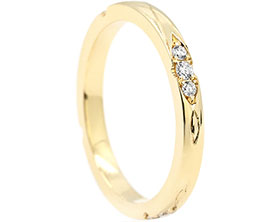 24605-yellow-gold-wedding-ring-with-brilliant-cut-diamonds-and-celtic-engraving_1.jpg