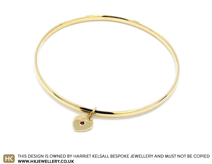 Angelina's 9ct Yellow Gold Bangle with Ruby Set Heart Charm