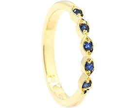 25279-yellow-gold-and-sapphire-eternity-ring-in-marquise-shaping_1.jpg