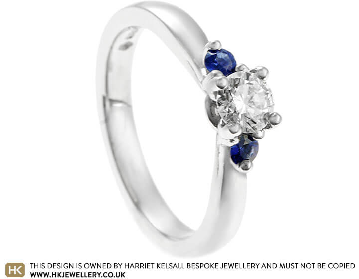 Sweeping Platinum, Diamond and Sapphire Trilogy Style Engagement Ring