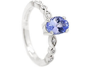 24544-white-gold-engagement-ring-with-diamonds-and-central-tanzanite_1.jpg