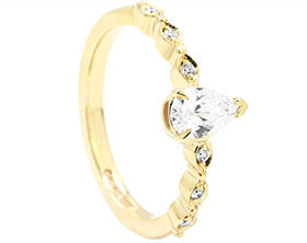 24925-yellow-gold-pear-cut-diamond-engagement-ring-with-round-and-marquise-shaping_1.jpg