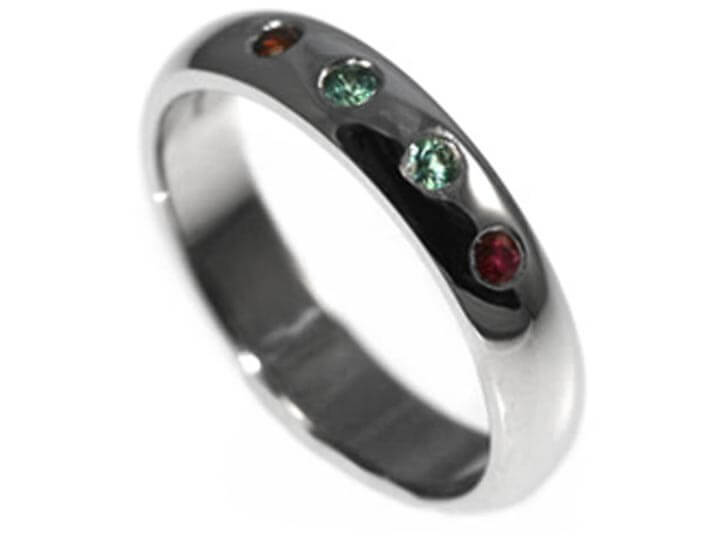 Lesley's platinum eternity ring with beautiful coloured stones