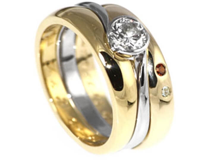 Jennie-Lee's  yellow gold garnet and sapphire eternity ring