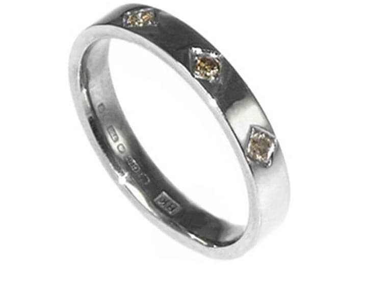 Grain set cognac diamond and 18ct white gold eternity band 