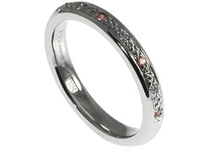 Platinum, diamond and pink sapphire eternity ring