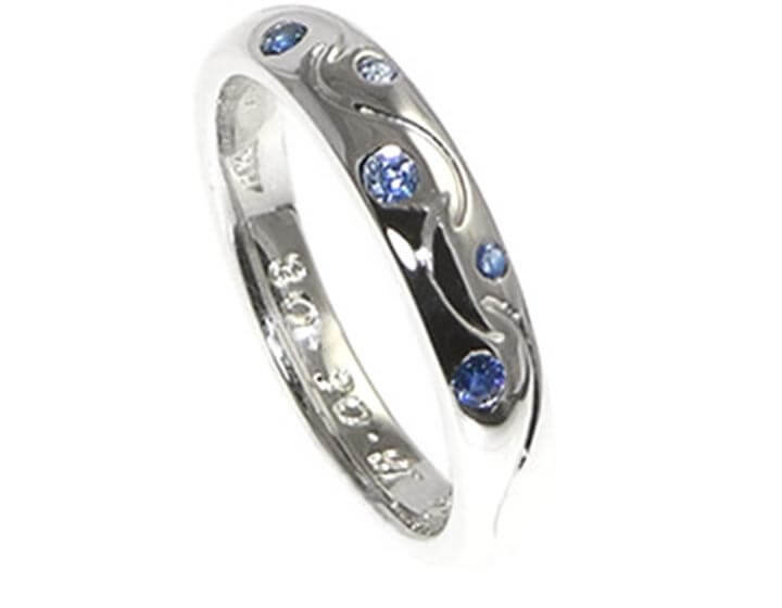 9ct white gold eternity ring with five invisibly set sapphires 