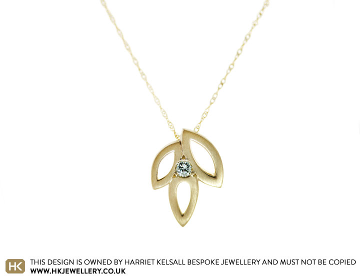 Darcy's diamond and yellow gold leaf pendant