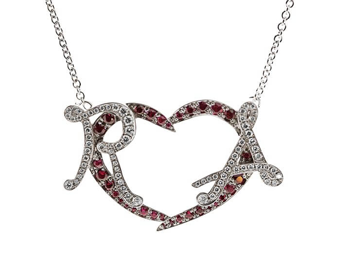 Alan and Rachael's initial pendant with rubies and diamonds