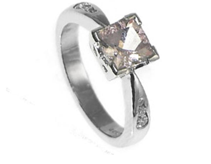 Bespoke palladium engagment ring with a square cushion cut morganite