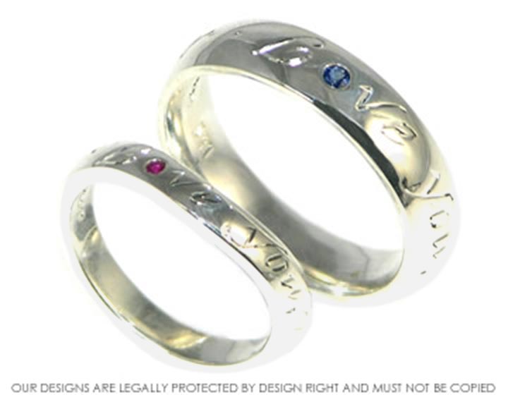 Bespoke pair of wedding rings with engraved lettering.